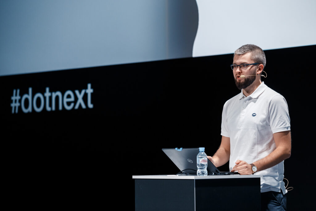 Łukasz Pyrzyk speaking at DotNext